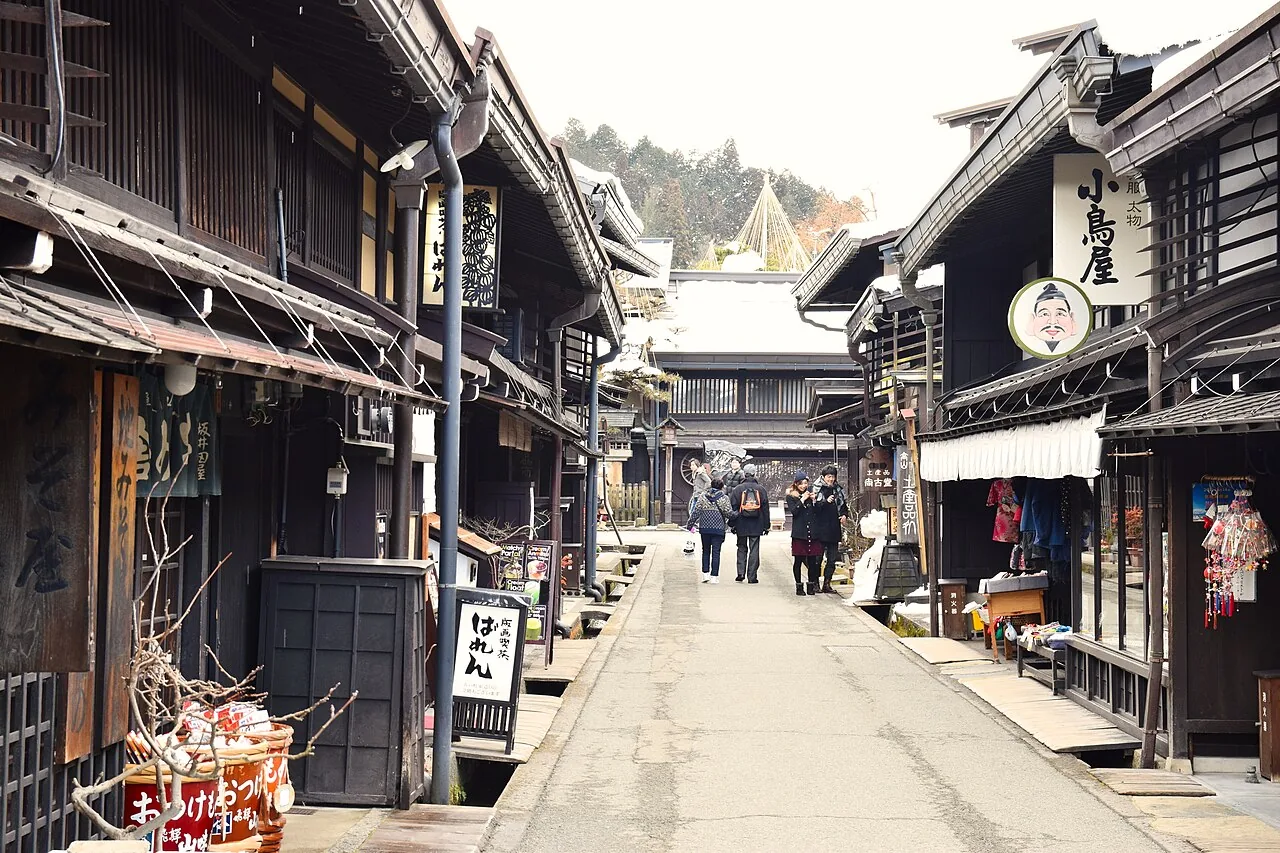 Dark wooden merchant houses lining a quiet street in Takayama's old town